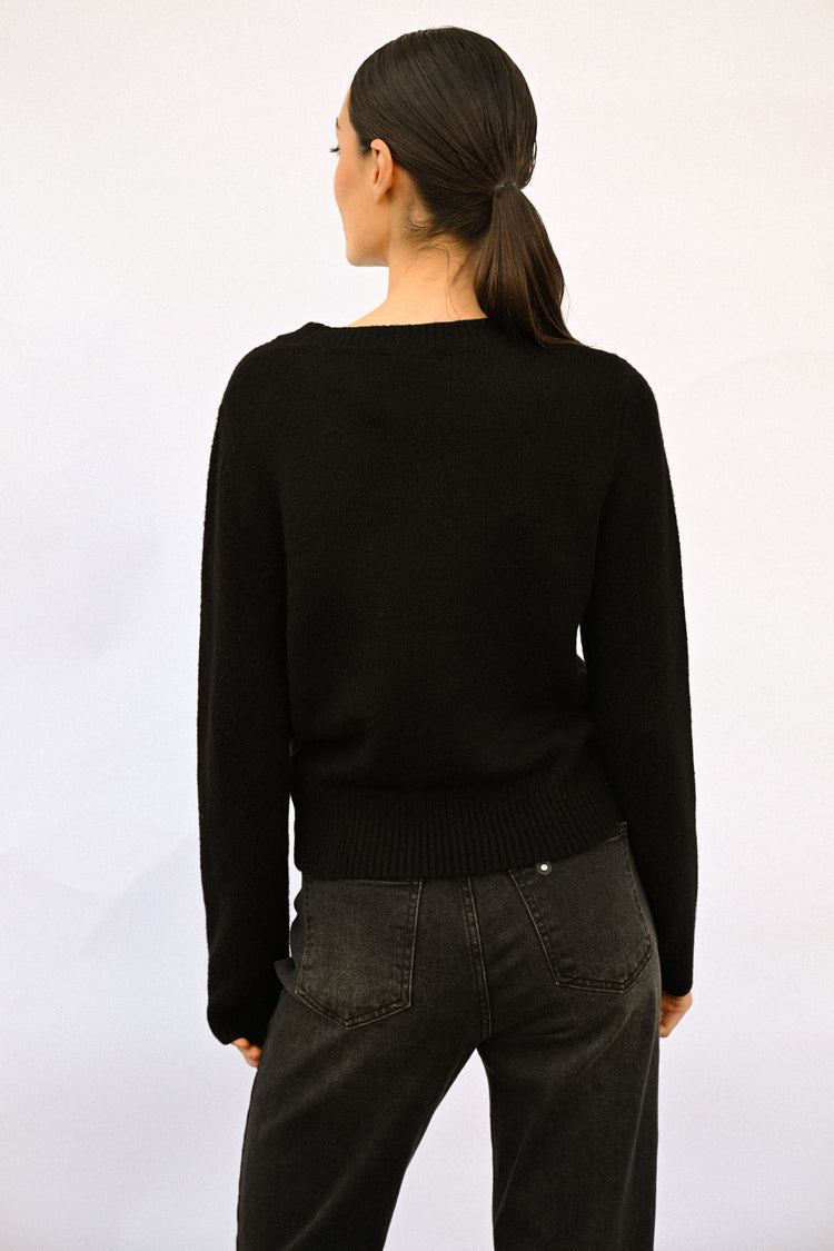 Pull con decorazione fiocchi