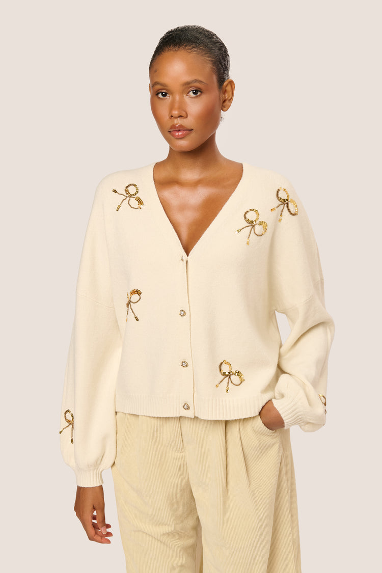 Cardigan con fiocchi in paillettes