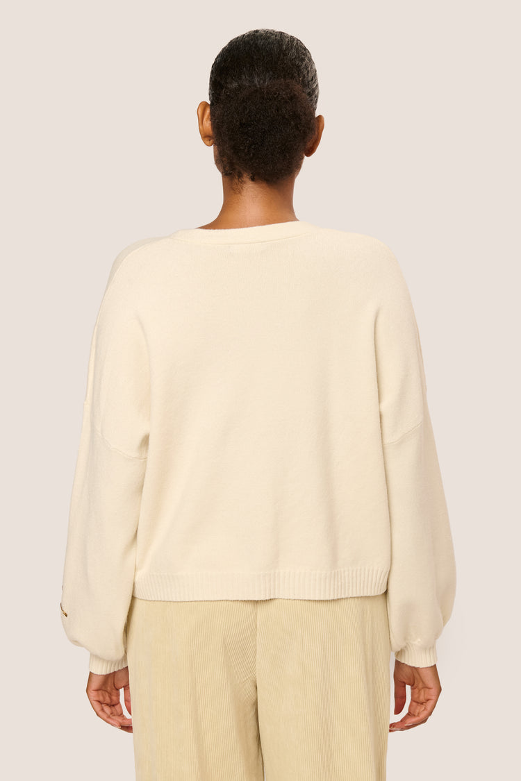 Cardigan con fiocchi in paillettes