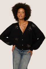 Cardigan con fiocchi in paillettes