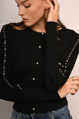 Cardigan con perle e strass decorativi