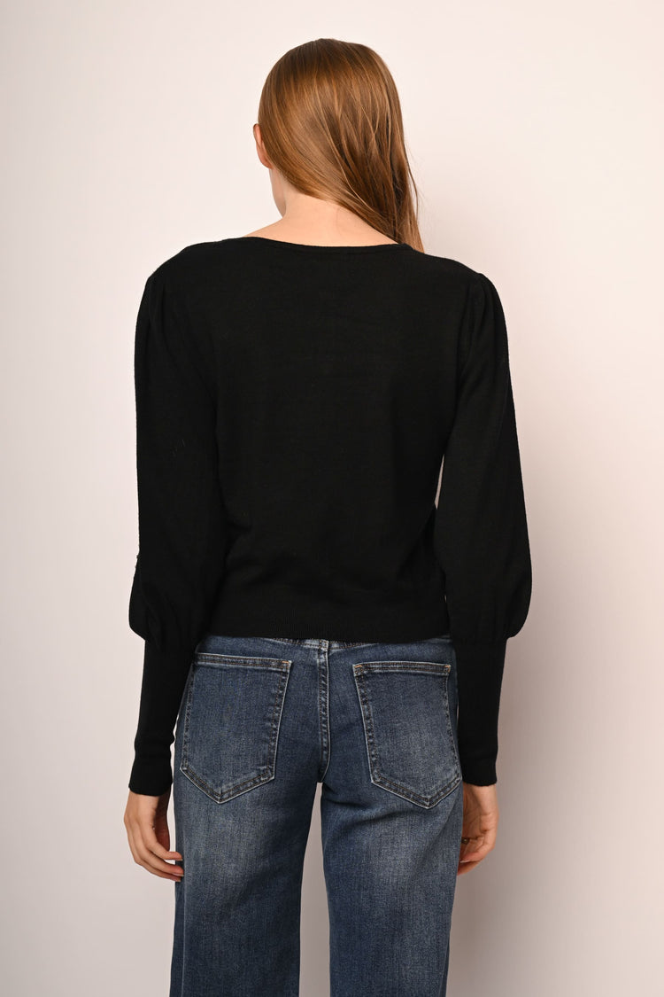 Cardigan con perle e strass decorativi