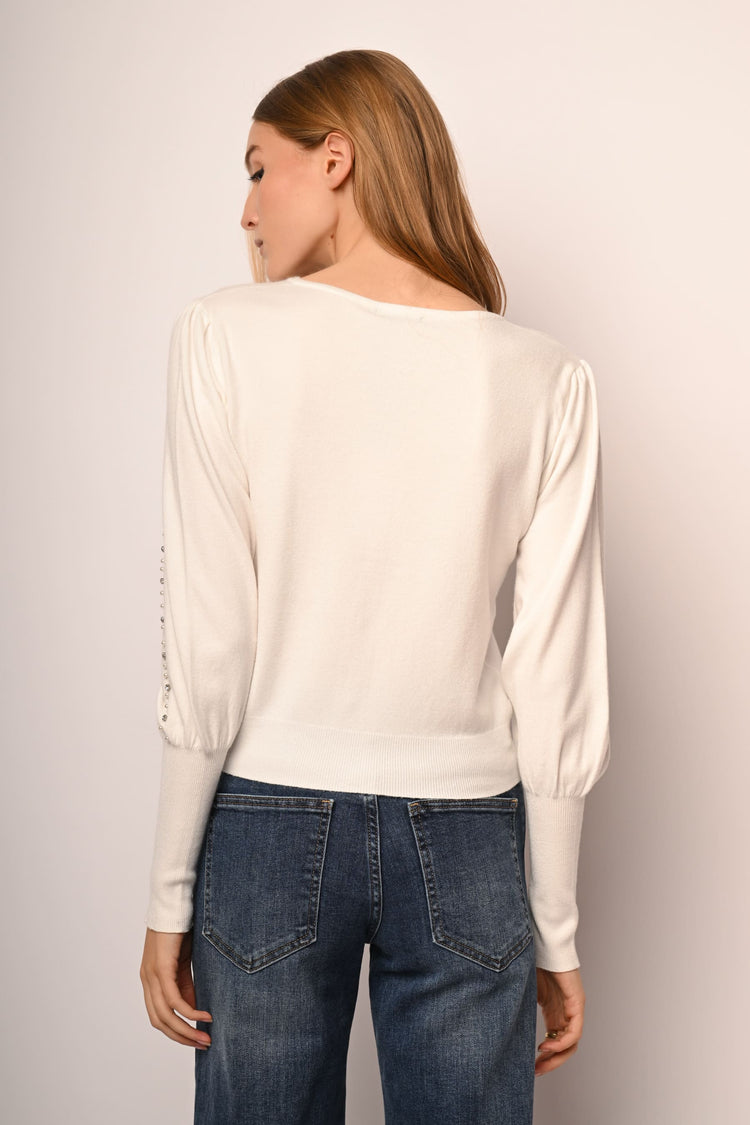 Cardigan con perle e strass decorativi