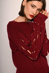 Pull con cut-outs e strass sulla maniche
