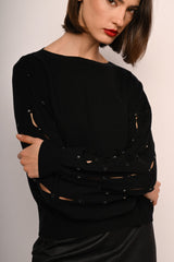 Pull con cut-outs e strass sulla maniche