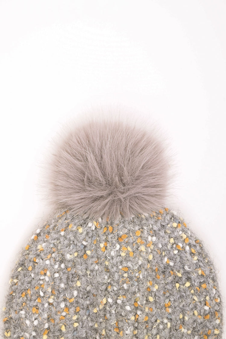 Berretto in maglia con pompon