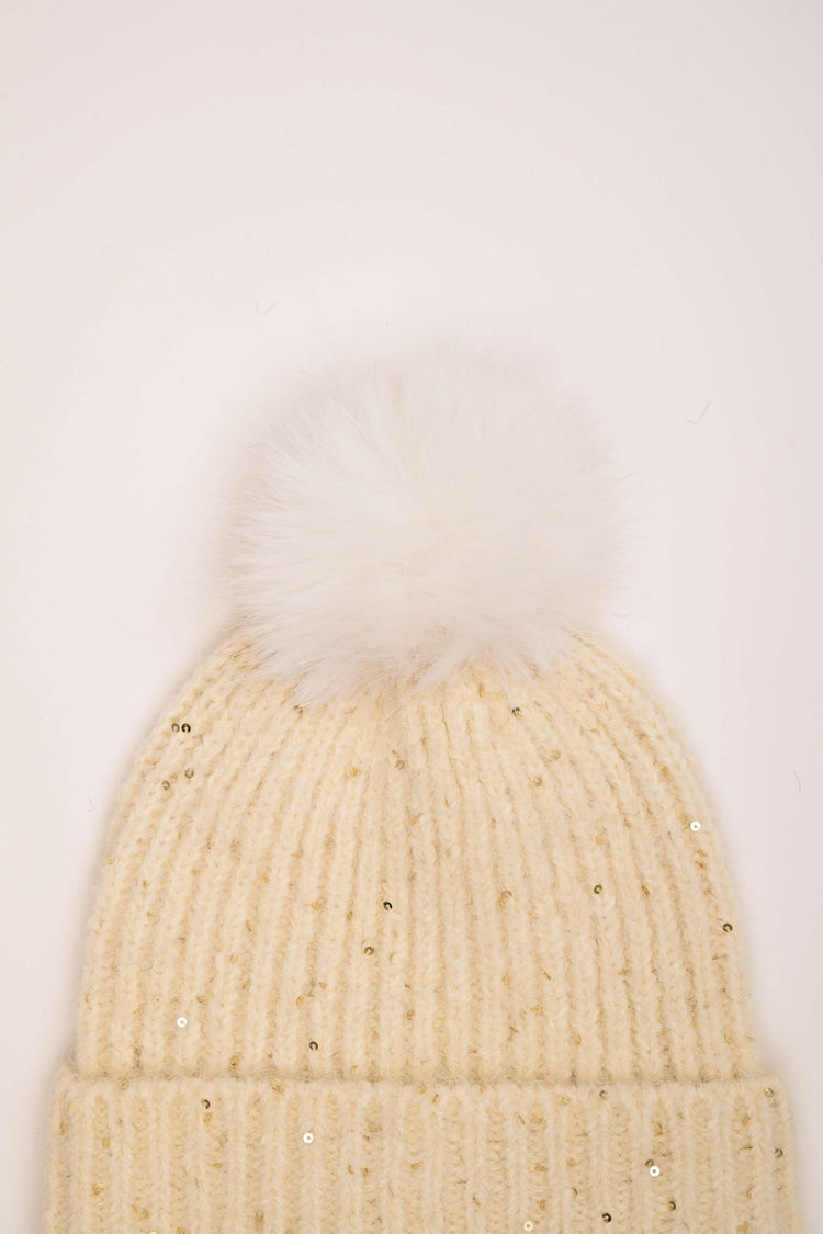Berretto con pompon e paillettes