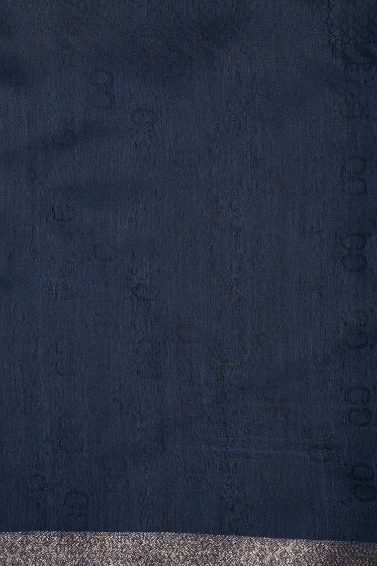 Stola con motivi geometrici blu e banda dorata