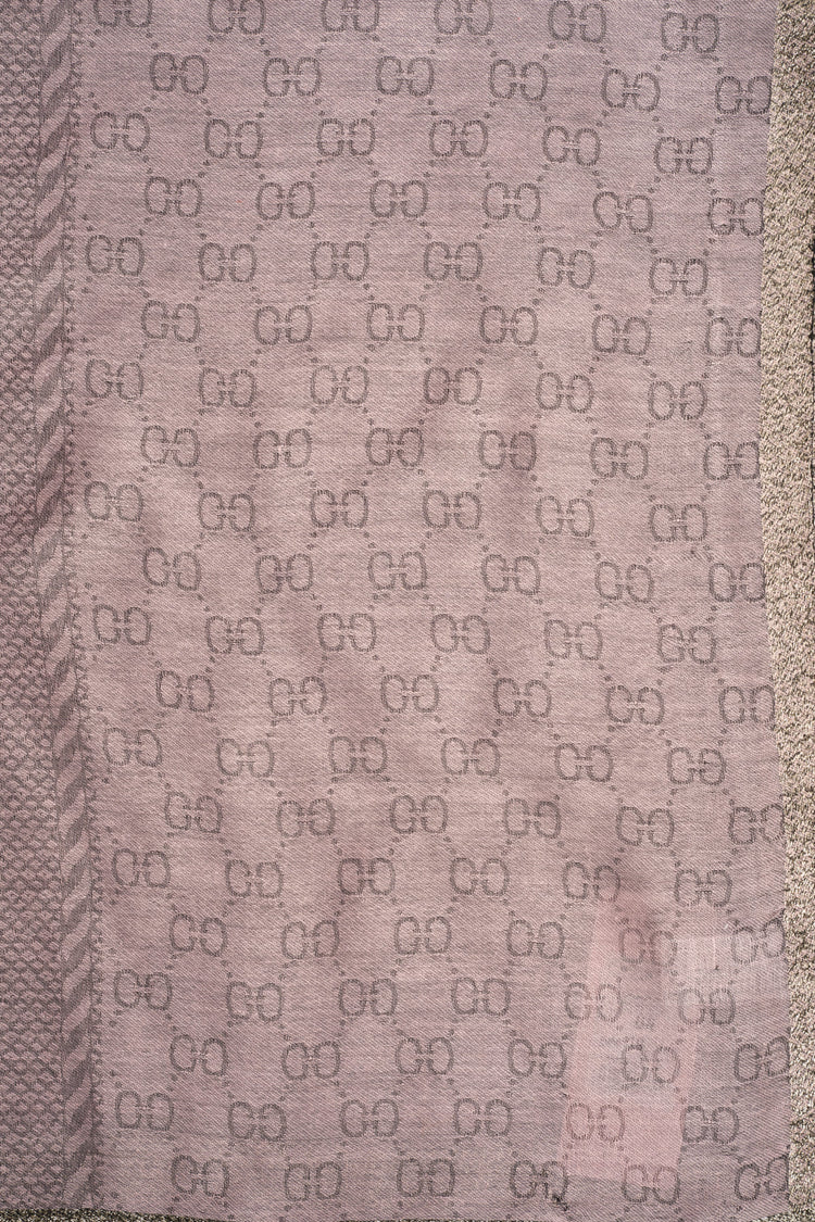 Stola con motivi geometrici rosa e banda dorata
