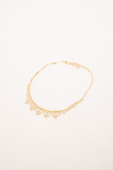 Collana in metallo dorato con pendenti in strass