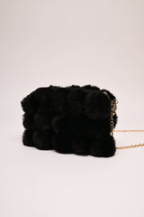 Borsa con pompon in faux fur