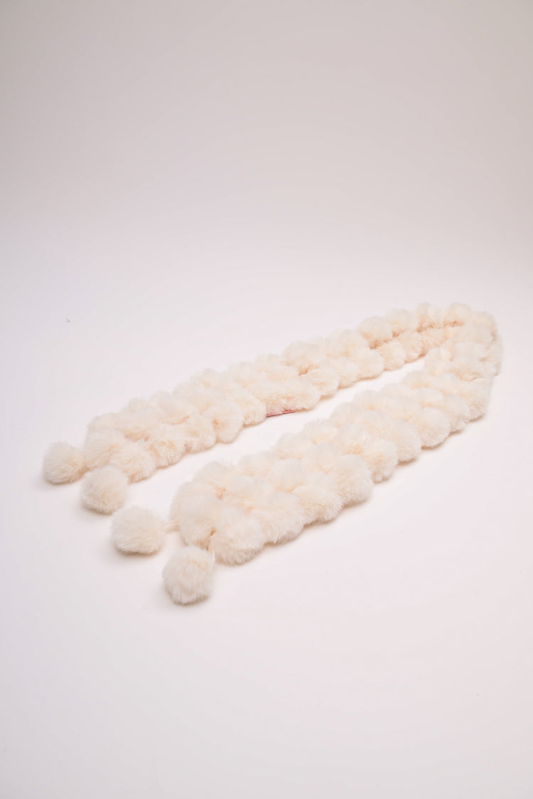 Collo con pompon in faux fur