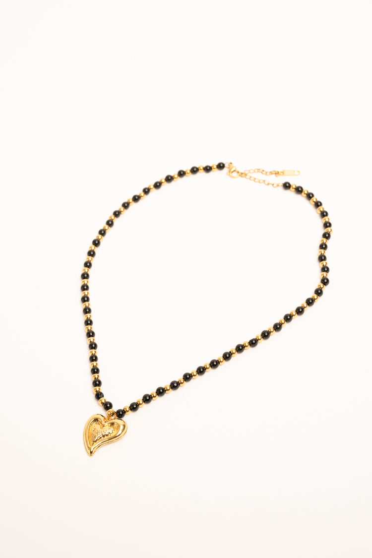 Collana con perline e pendente a cuore oro