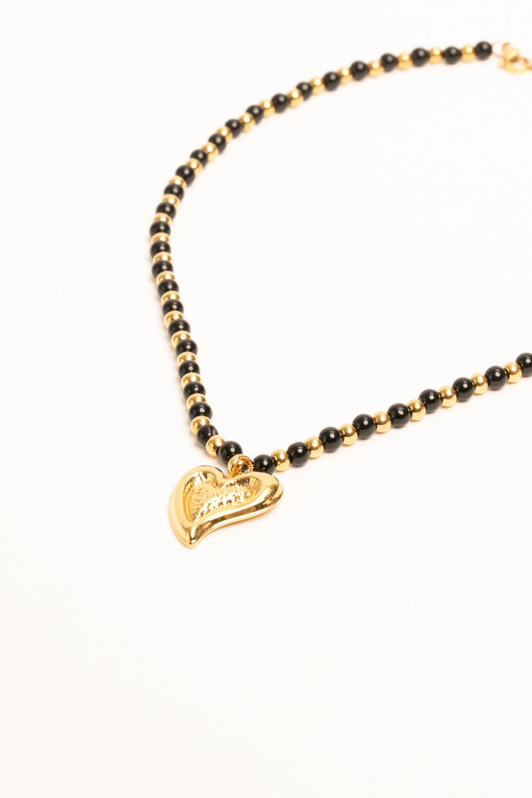 Collana con perline e pendente a cuore oro