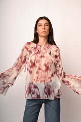 Blusa a stampa astratta con volants