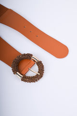 Cintura elastica con fibbia tonda in perline