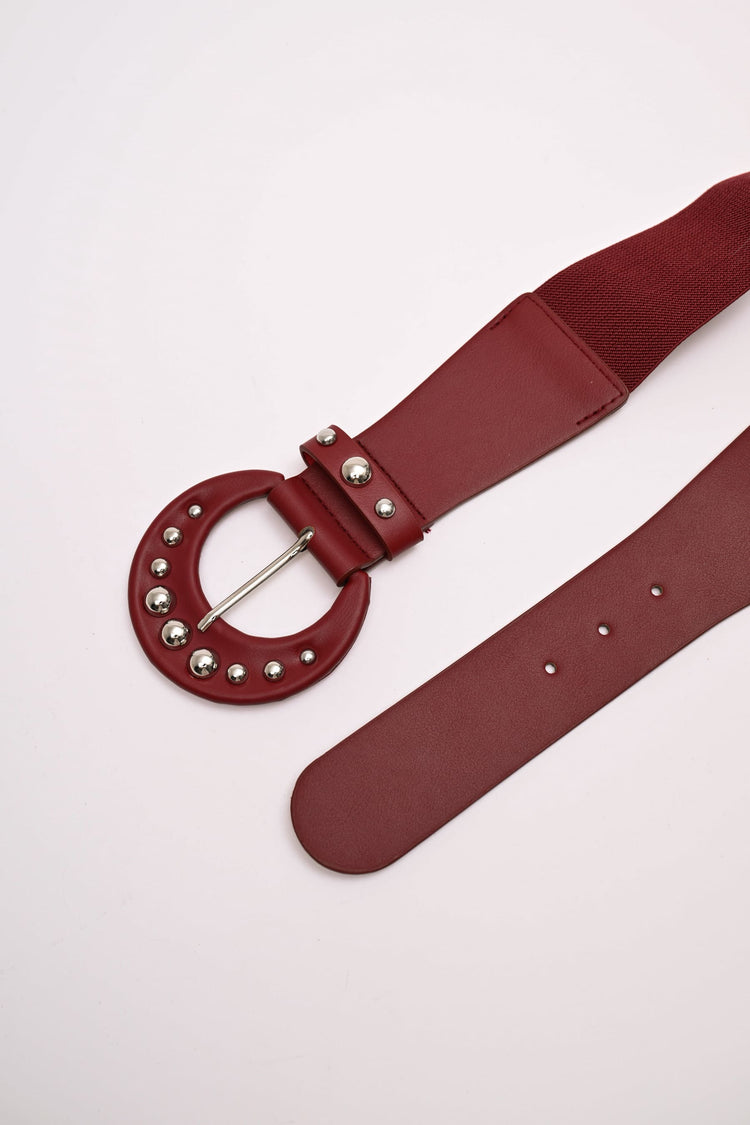 Cintura elastica con fibbia tonda e borchie