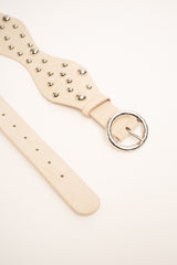 Cintura ondulata beige con borchie
