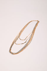 Collana lunga con catenelle e perline