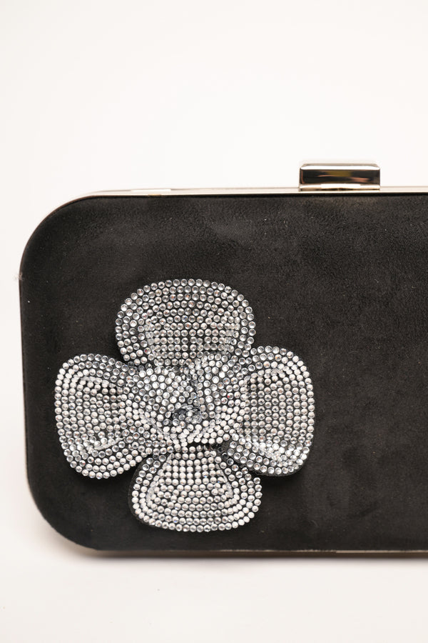 Clutch rigida in faux suede con fiore in strass