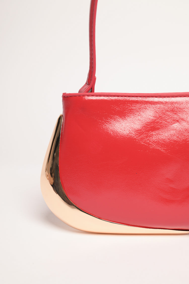 Borsa piccola rossa con placca dorata