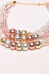 Collana con fili ondulati e perle multicolor