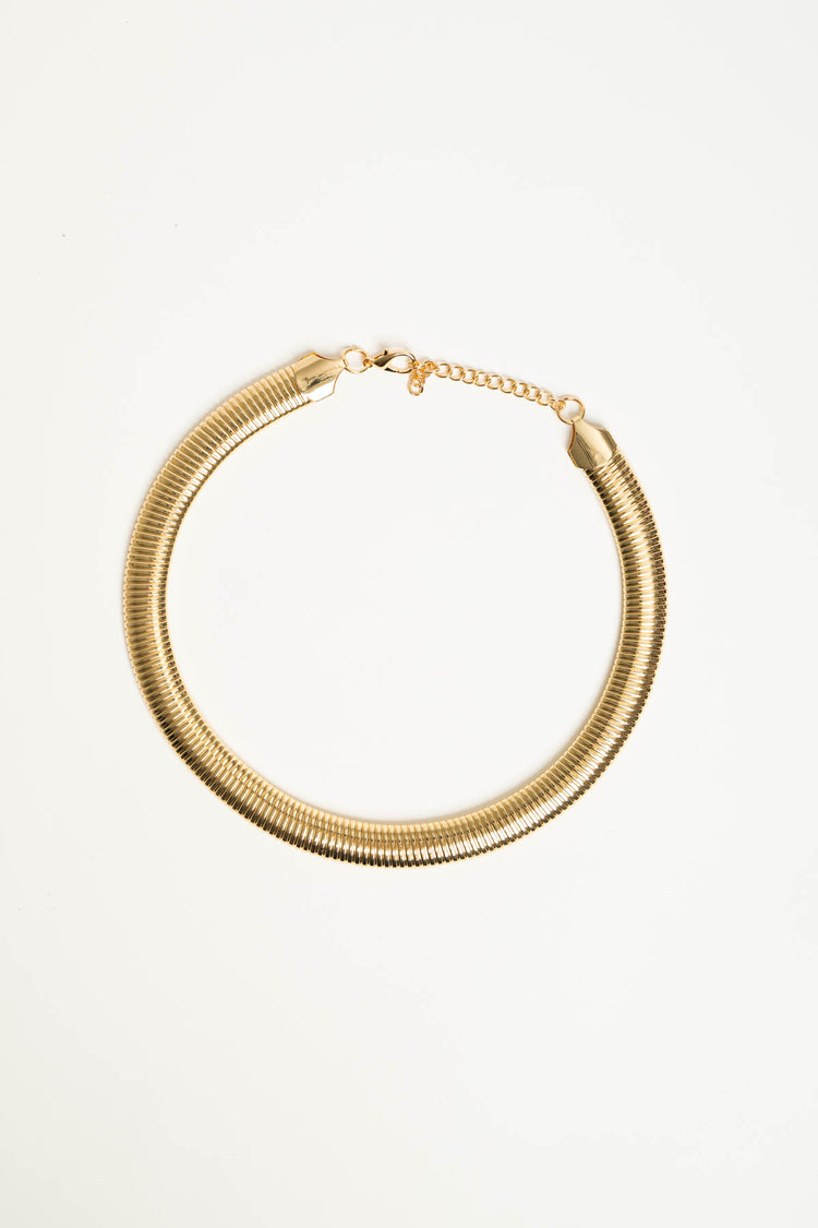 Collana rigida in metallo dorato
