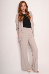 Pantaloni gessati beige a gamba svasata